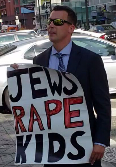 Man holds hateful sign in Beverly Hills cropped